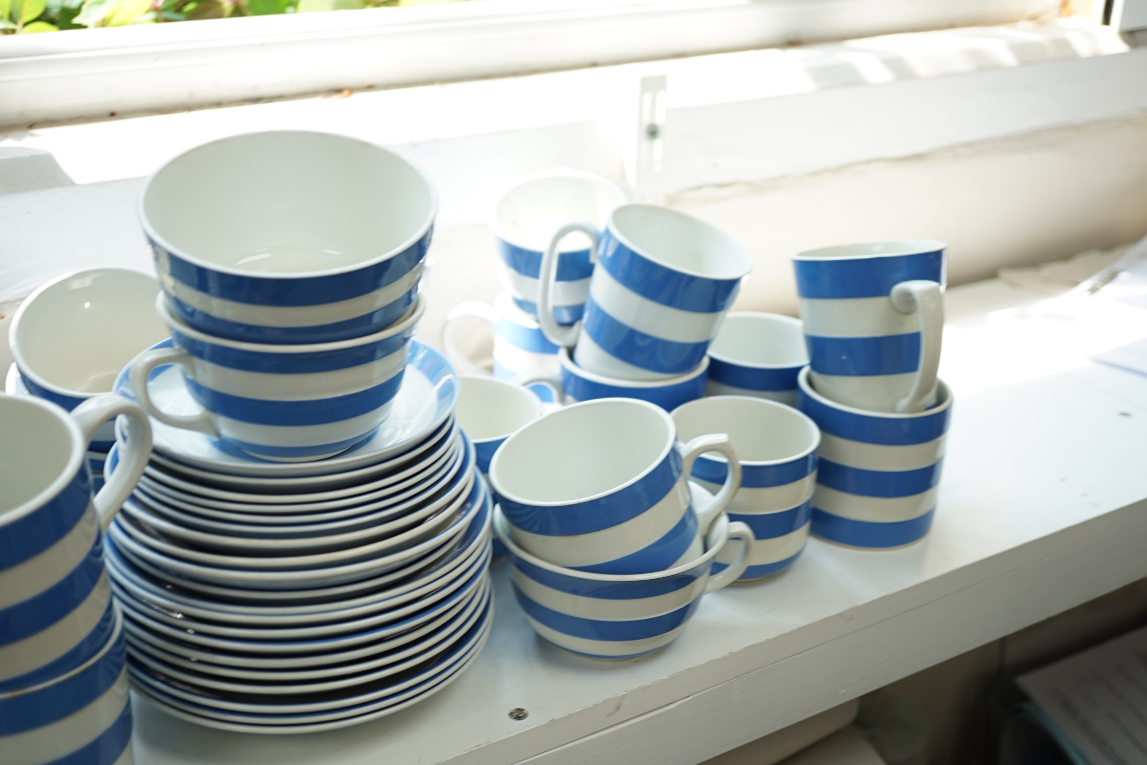 T.G.Green Cornish Kitchenware, a collection of assorted tea and coffee cups, saucers and beakers, approximately sixty pieces, Green Shield marks. Condition - poor, fair and good
